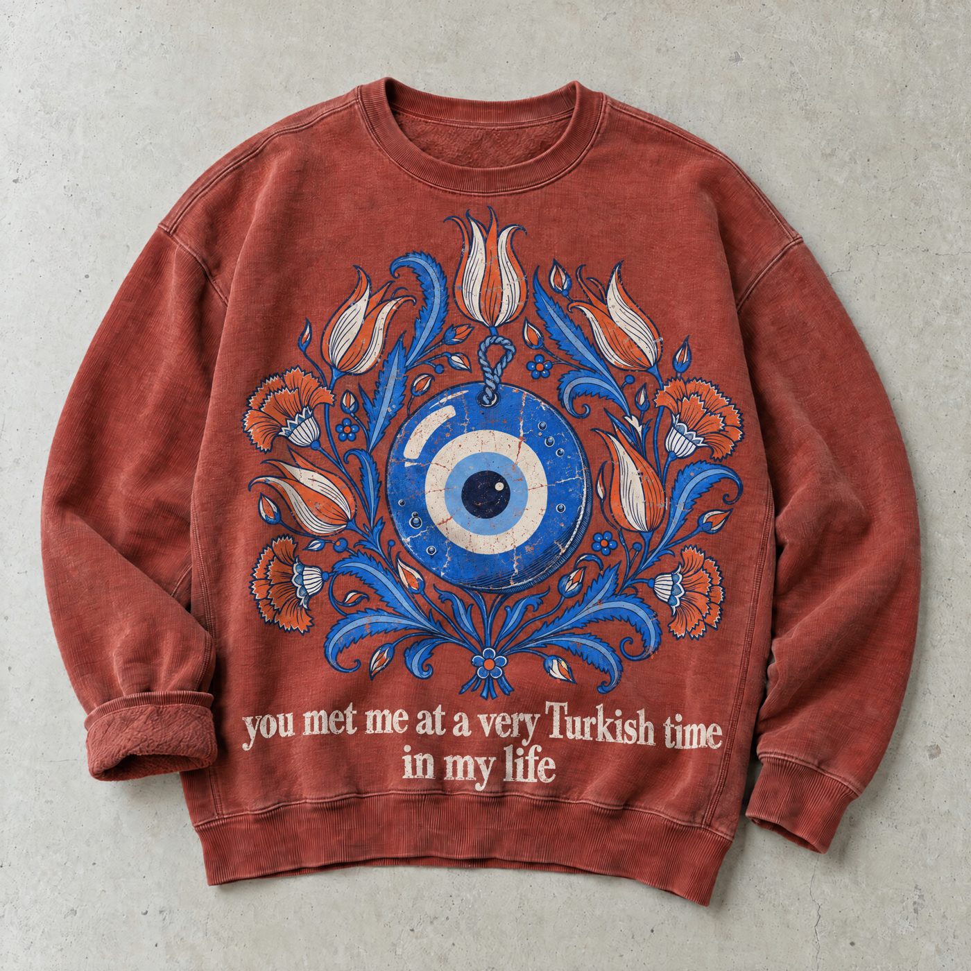 Red crewneck sweatshirt with a nazar and tulip print and the line you met me at a very Turkish time in my life